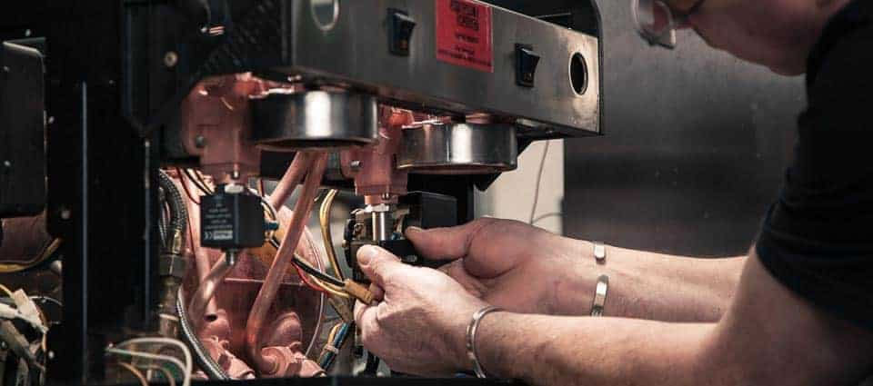 Engineer Working On Coffee Machine
